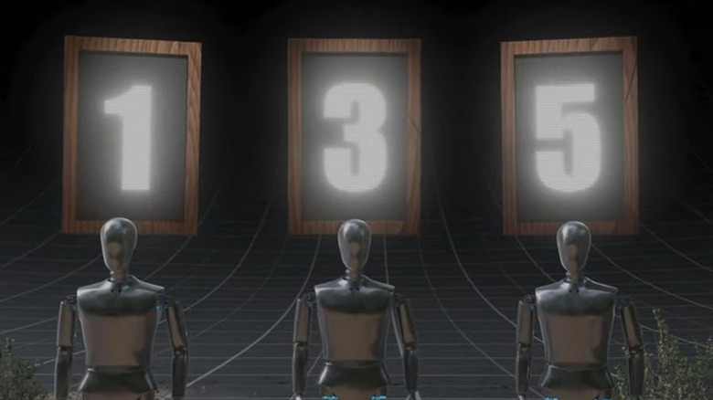 Marionettes with numbers behind them on Beast Games