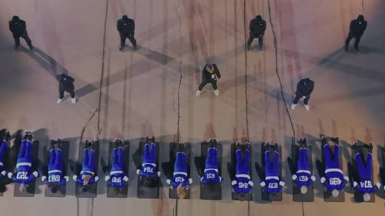 Contestants doing push-ups on Beast Games