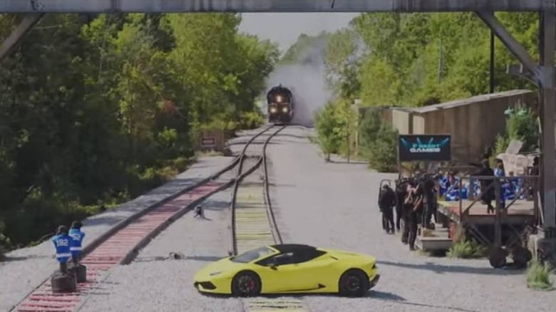 Train barrelling toward a Lamborghini on Beast Games