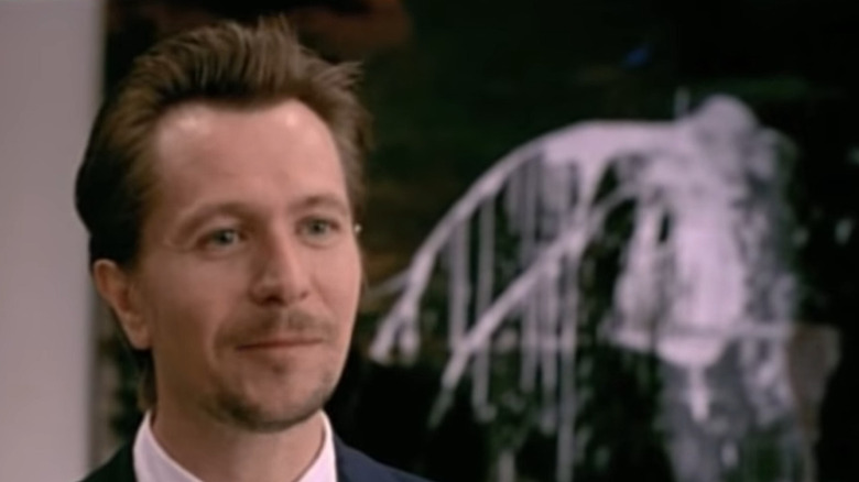 Gary Oldman smirks