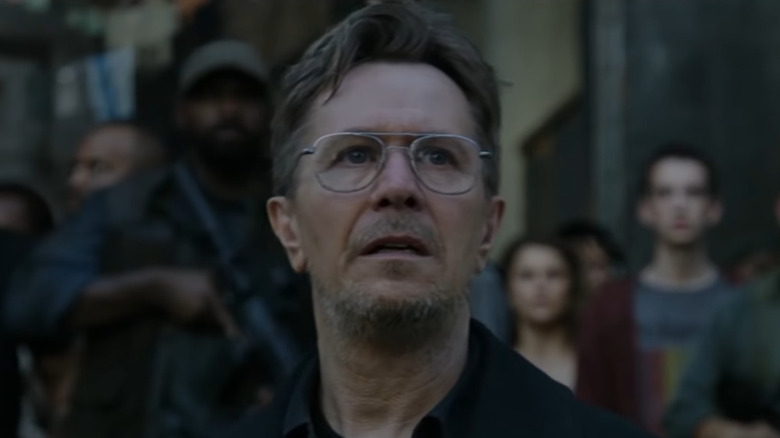 Gary Oldman looks at something off-screen