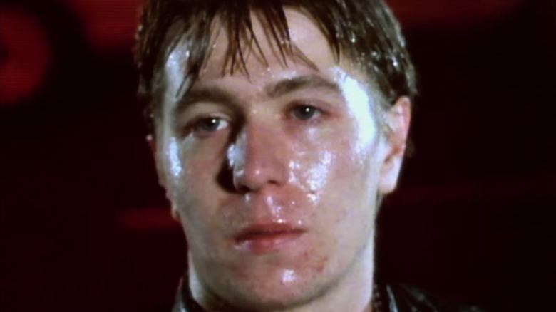 A young rain-soaked Gary Oldman