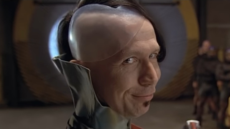 A smiling Gary Oldman with a headplate