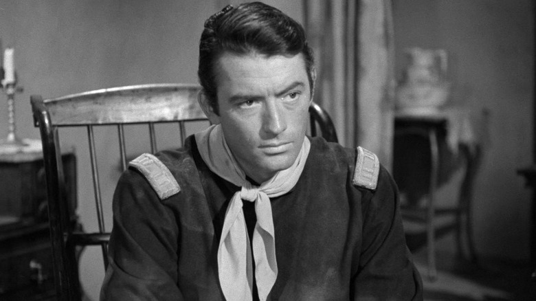 Gregory Peck in a wooden chair