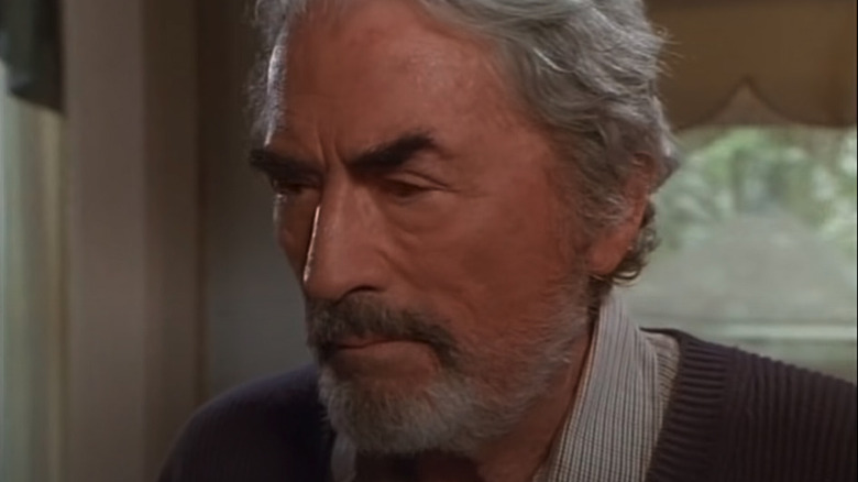 Gregory Peck looks left