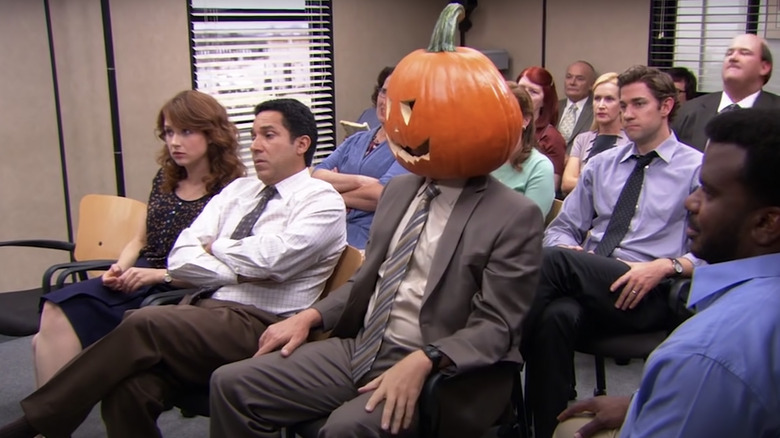 Dunder Mifflin employees attend meeting