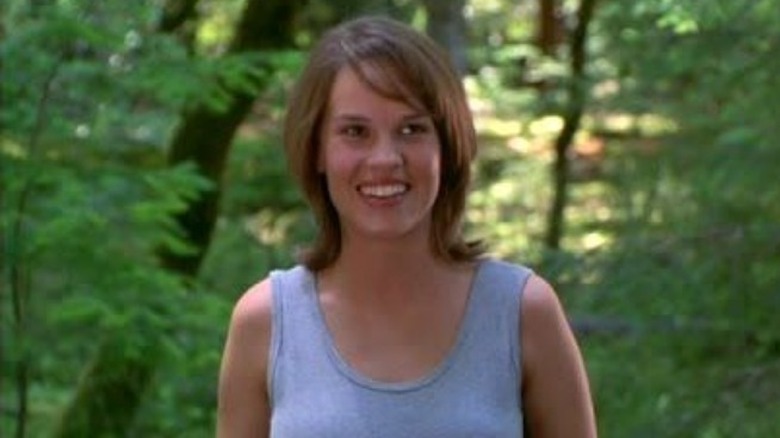 Hilary Swank smiling in the forest 