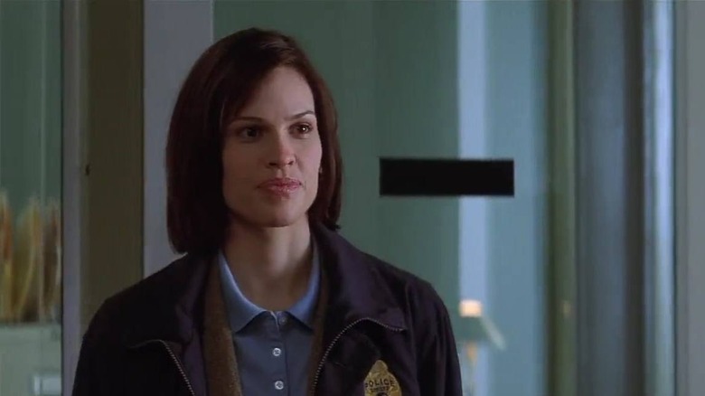 Hilary Swank in a cop uniform