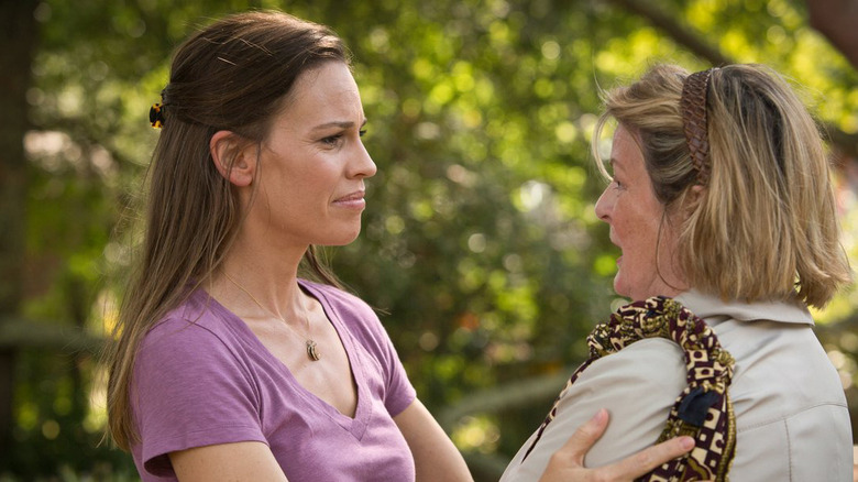 Hilary Swank and Brenda Blethyn looking at each other while embracing