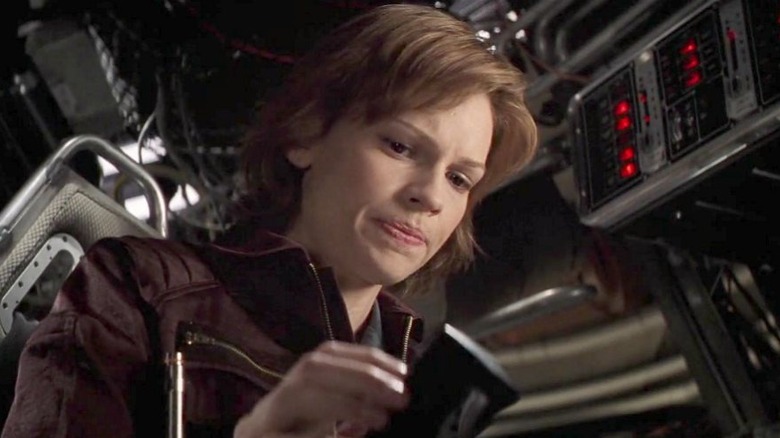 Hilary Swank in the driver's seat of a spaceship