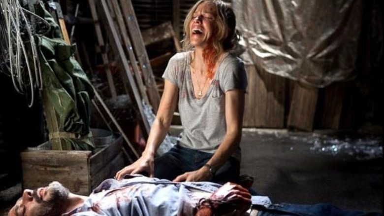 Hilary Swank covered in blood and crying over a dead man's body