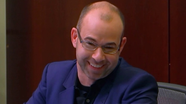 Murr in chair laughing