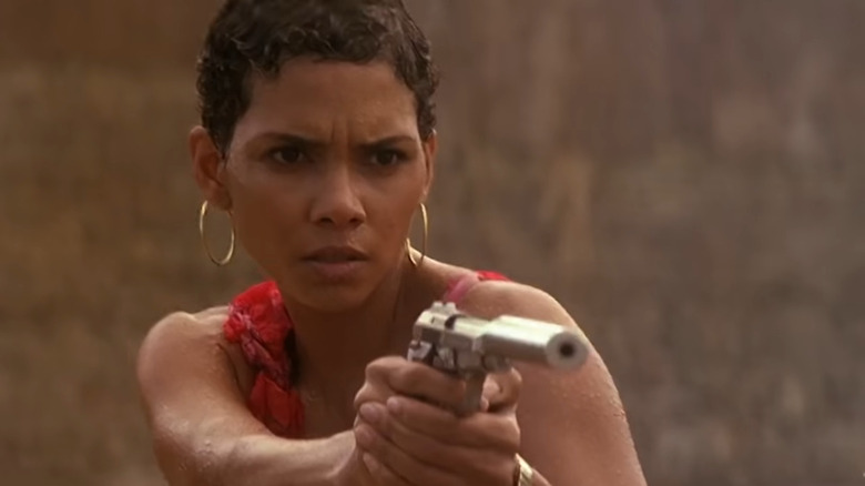 Halle Berry holds gun