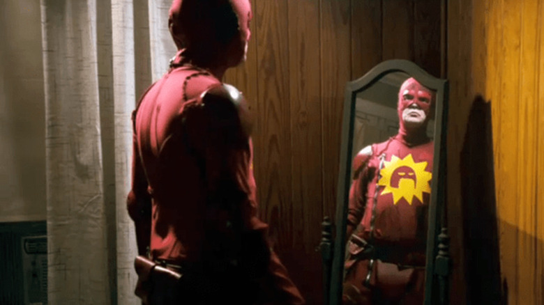 Frank gives his Crimson Bolt costume a final look