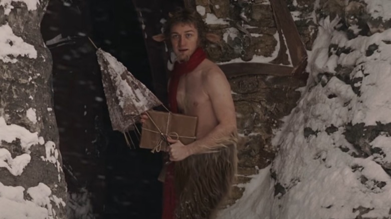 Mr. Tumnus outside with umbrella