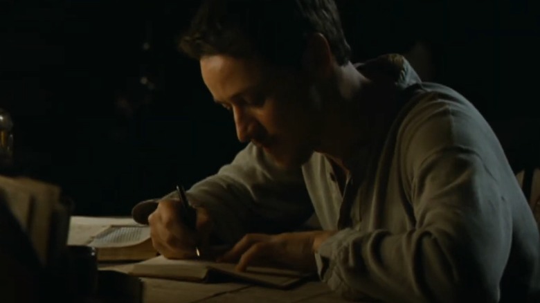 Valentin writing in his diary