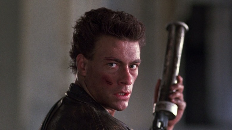 Jean-Claude Van Damme readies his gun