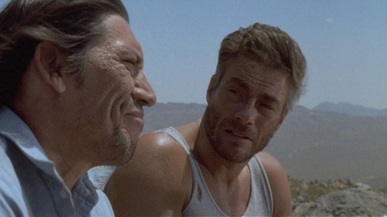 Jean-Claude Van Damme talks to his friend in the desert