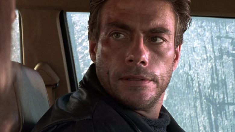 Van Damme in a car in the rain