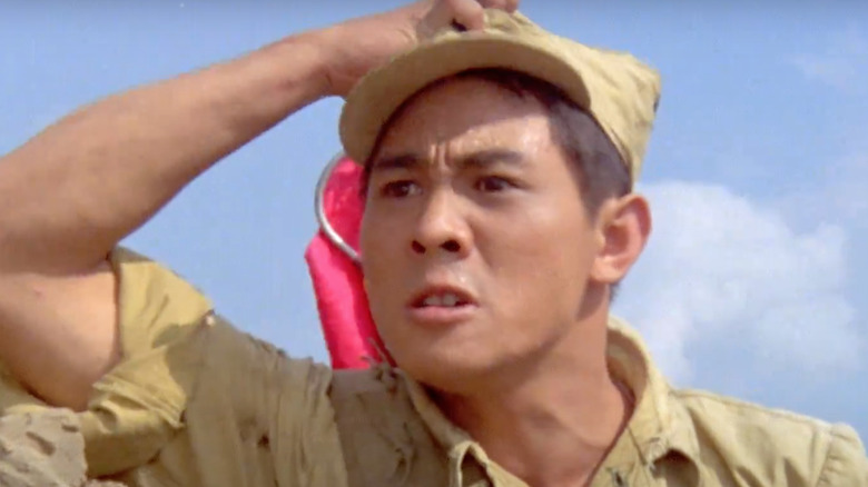 Jet Li in military uniform holding hat