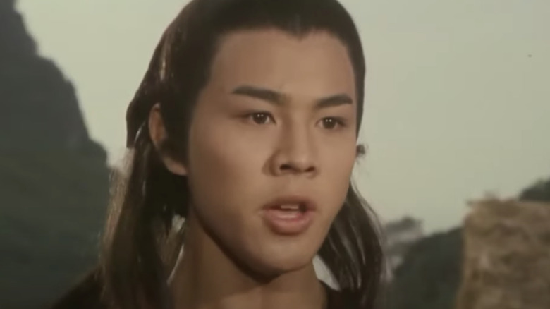 Jet Li young with long hair talking