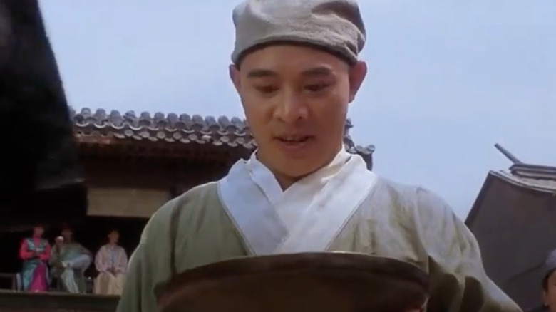 Jet Li holding collection tray