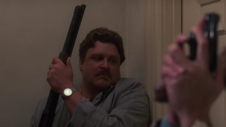 John Goodman with shotgun