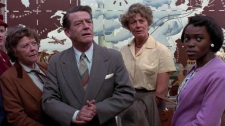 John Hurt and three women look right