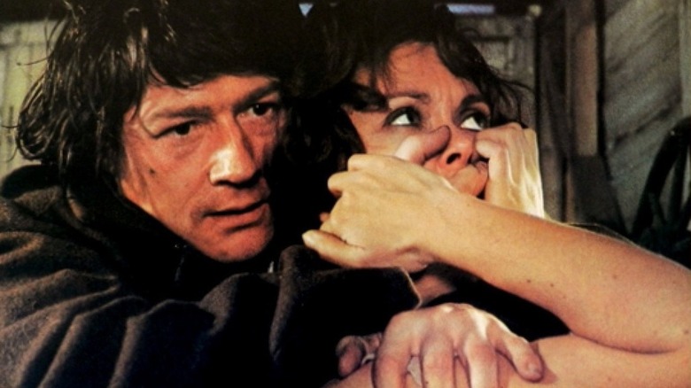 John Hurt covers a woman's mouth