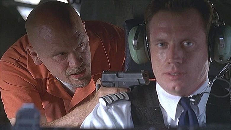 malkovich holds gun on pilot fredric lehn/ con air