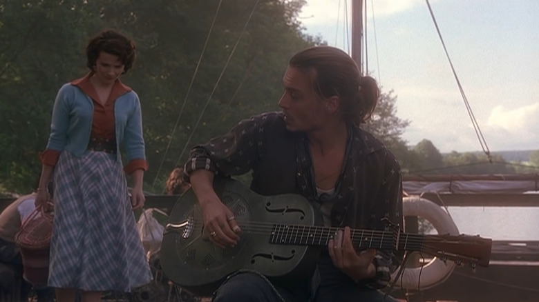 Depp playing guitar in Chocolat