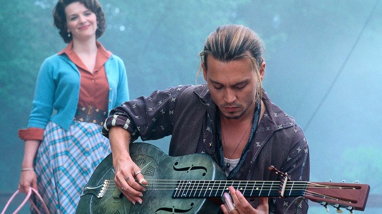 Roux plays guitar in "Chocolat" (2000)