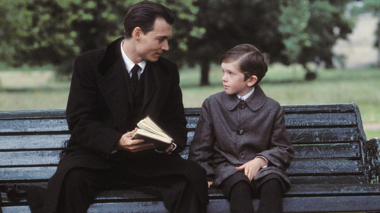 J.M. Barrie speaks with a child in "Finding Neverland" (2004)