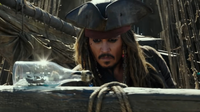 Captain Jack Sparrow with ship in bottle in "Dead Men Tell No Tales" (2017)