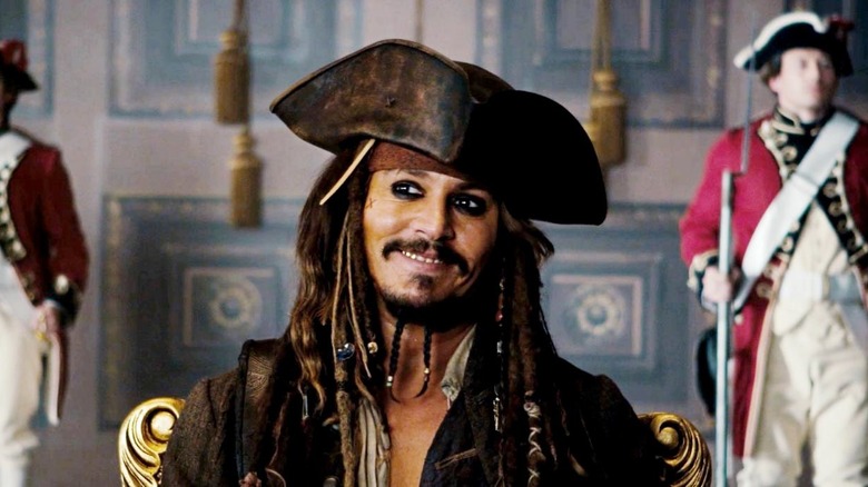 Jack Sparrow smiling in front of soldiers