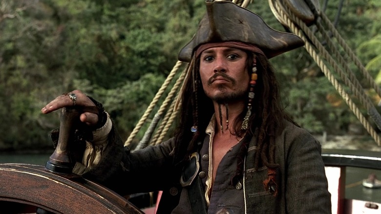 Jack Sparrow steers his ship in "The Curse of the Black Pearl" (2003)