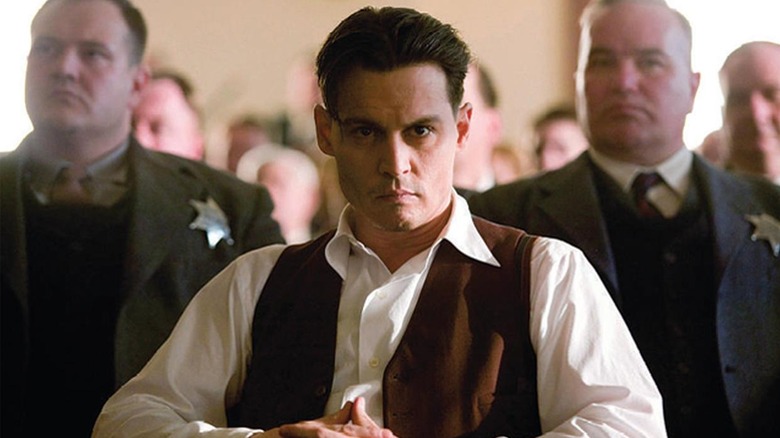 John Dillinger in custody in "Public Enemies" (2009)