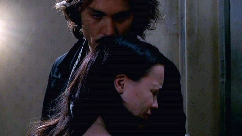 Johnny Depp hugging Christina Ricci