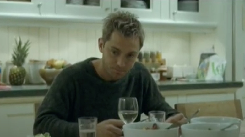 Jude Law at kitchen table