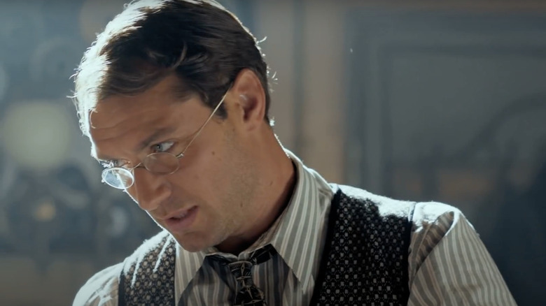 Jude Law in glasses and vest