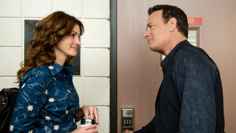 Mercedes and Larry talk by a door in "Larry Crowne" (2011)