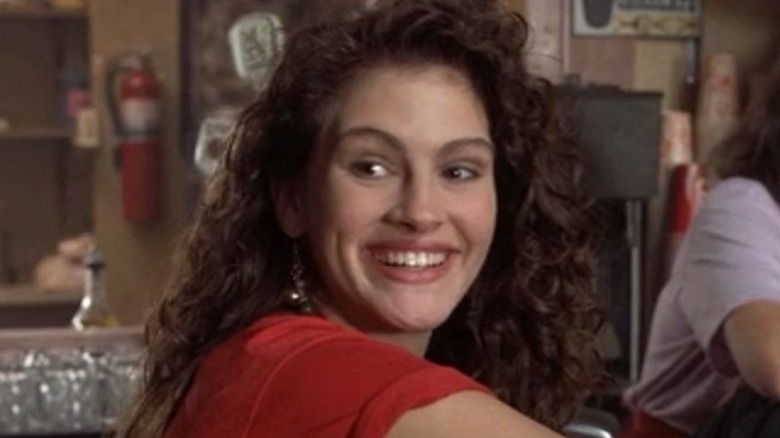 Daisy smiles behind the counter in "Mystic Pizza" (1988)