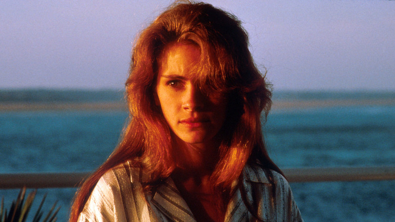 Laura/Sara stands in front of the ocean in "Sleeping with the Enemy" (1991)