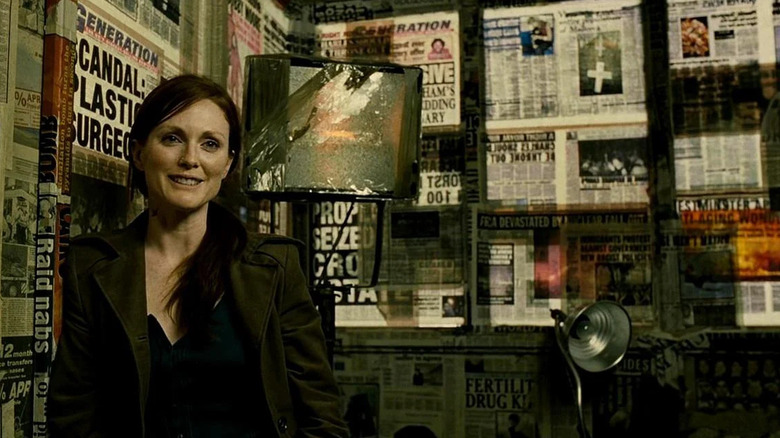 Julian Taylor in front of newspaper clippings in "Children of Men" (2006)