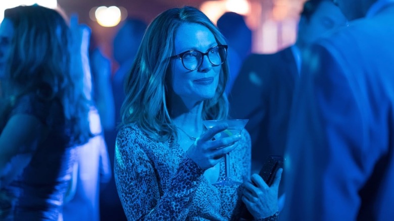 Gloria holds a martini glass in "Gloria Bell" (2018)