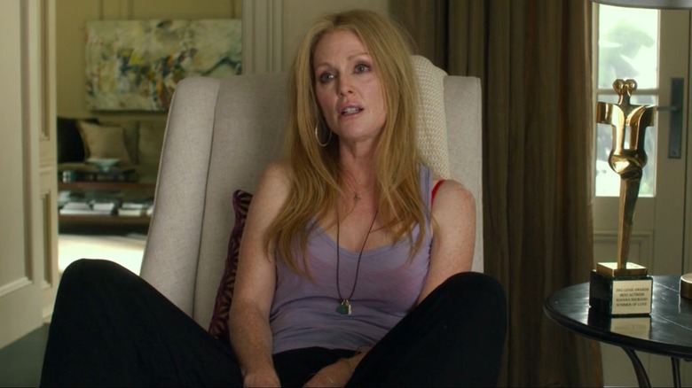 Havana slouches in a chair in "Maps to the Stars" (2014)