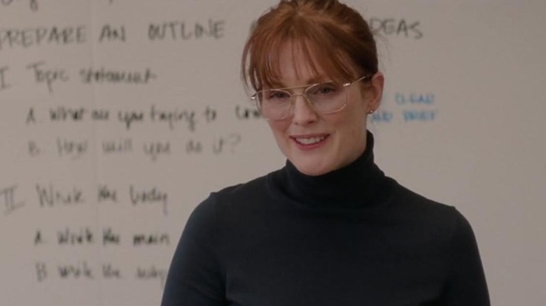 Linda Sinclair in front of a board in "The English Teacher" (2013)