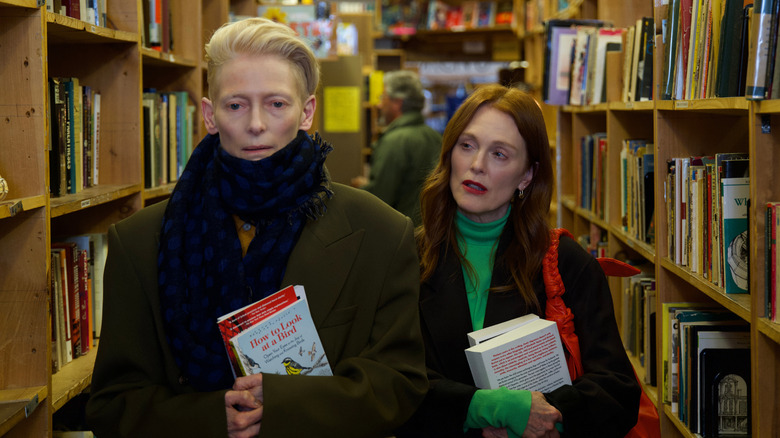 Ingrid and Martha walk in a bookstore in "The Room Next Door" (2024)