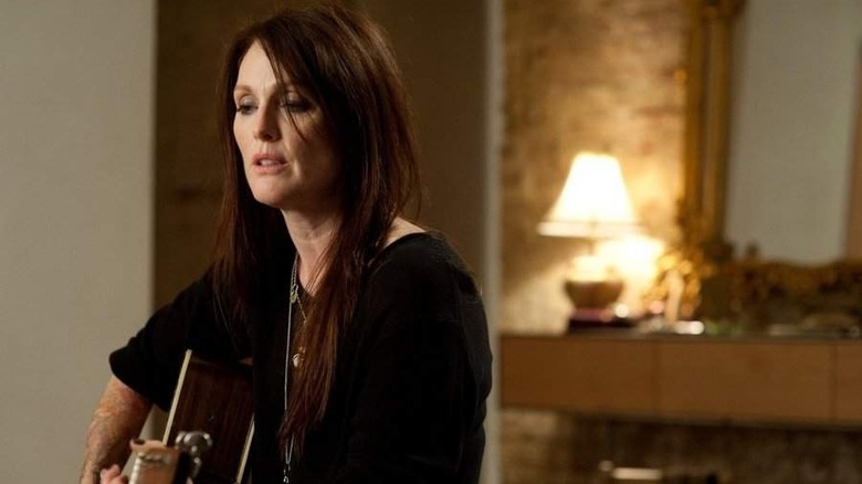 Julianne Moore playing guitar