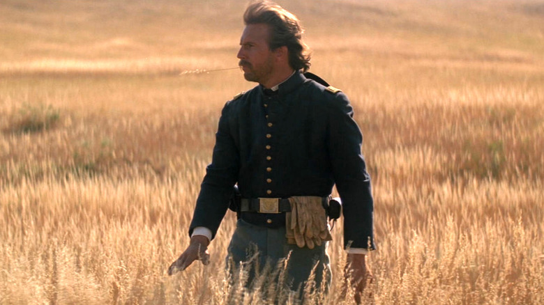 Kevin Costner wandering in wilderness